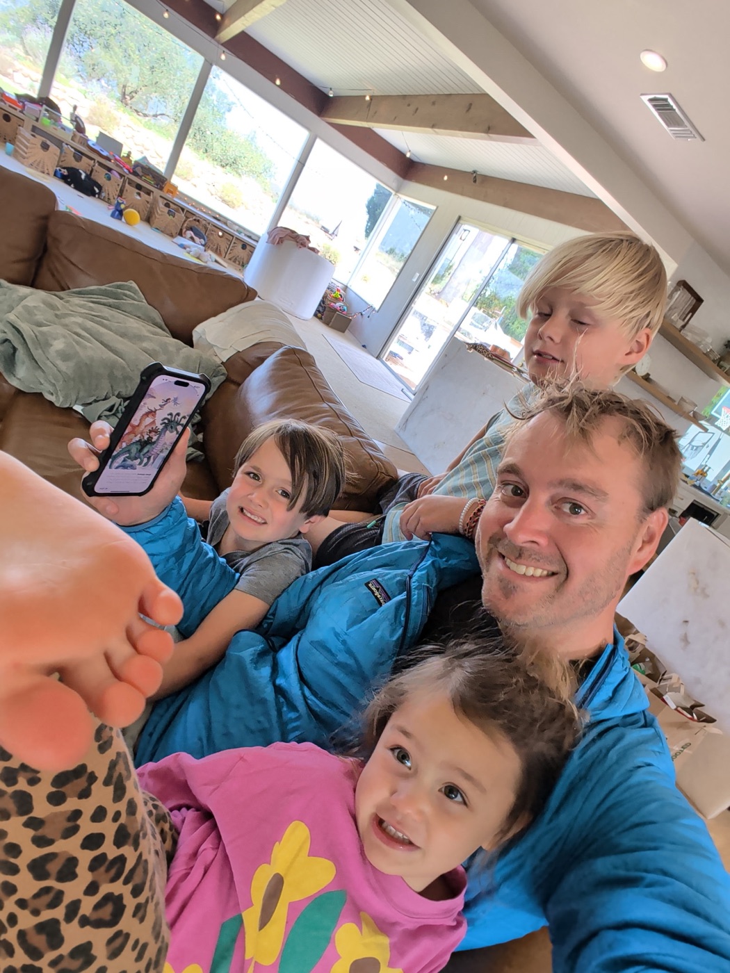 Family reading a StorySafari story together on a phone